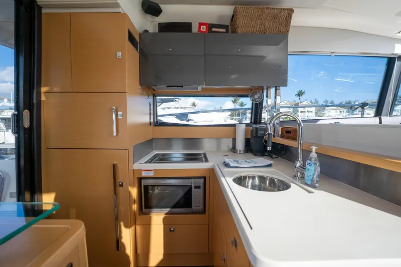 Slide: The Image of Modern kitchen interior on a 2013 Prestige 500S yacht, featuring sleek cabinetry and appliances. - 9