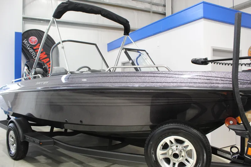 Slide: The Image of 2026 Skeeter Solera 189 boat on trailer in showroom, featuring sleek design and modern features. - 0