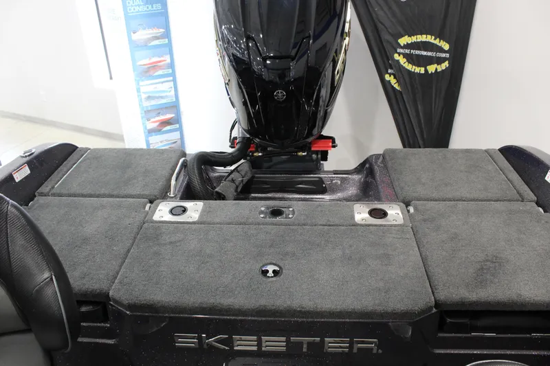 Slide: The Image of 2026 Skeeter Solera 189 boat interior with motor, featuring spacious deck and storage compartments. - 3