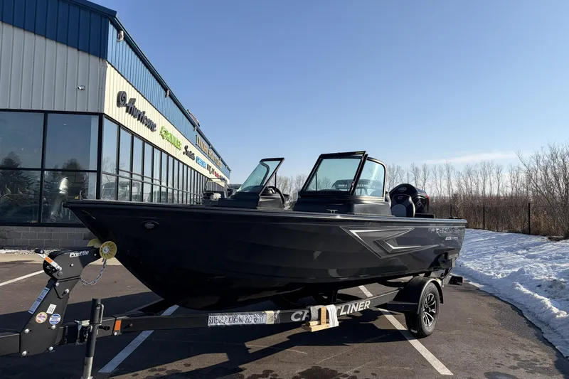 Slide: The Image of 2026 Crestliner 1850 Kodiak WT boat parked outside dealership on a sunny day. - 1