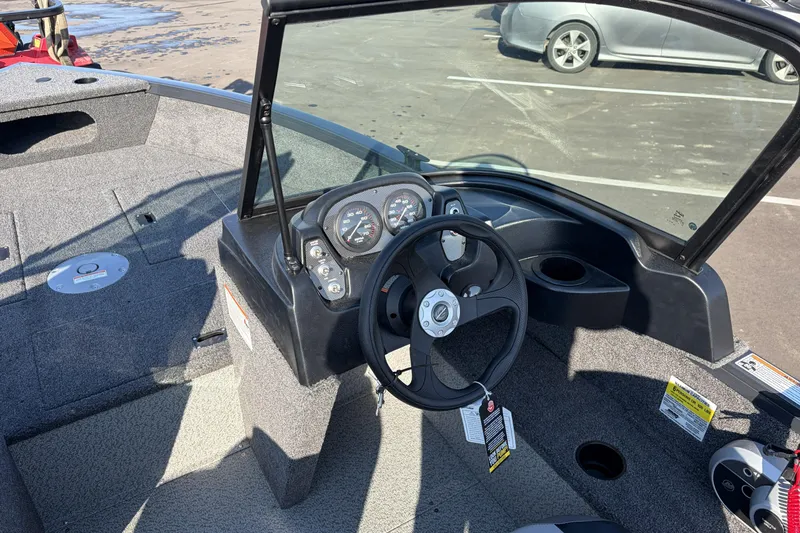 Slide: The Image of 2026 Crestliner 1850 Kodiak WT boat interior with steering wheel and dashboard controls. - 11