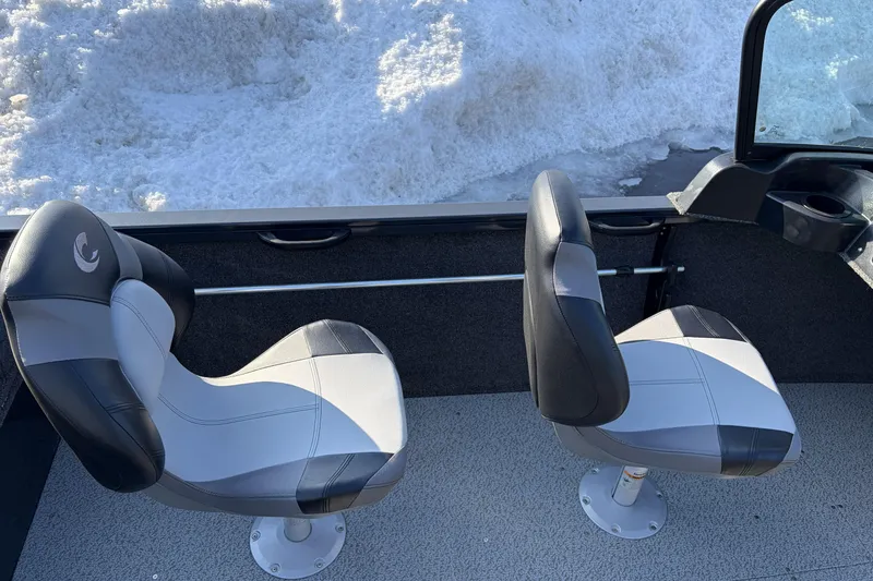 Slide: The Image of 2026 Crestliner 1850 Kodiak WT boat interior with two swivel seats, snowy background. - 16