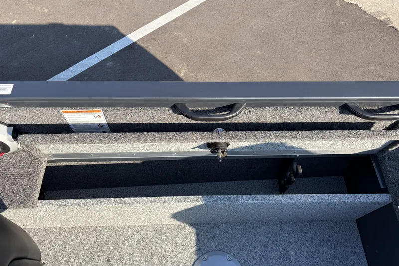 Slide: The Image of 2026 Crestliner 1850 Kodiak WT boat interior storage compartment, open and empty. - 22