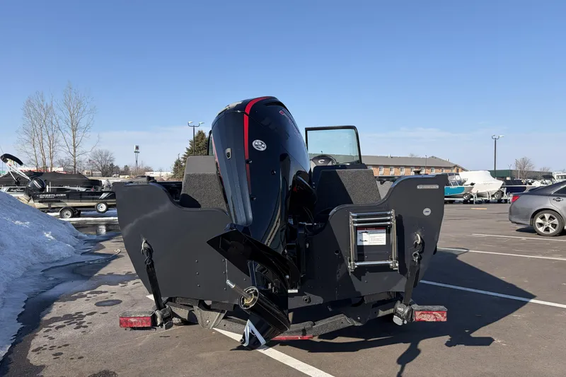 Slide: The Image of 2026 Crestliner 1850 Kodiak WT boat in parking lot, rear view with outboard motor. - 3