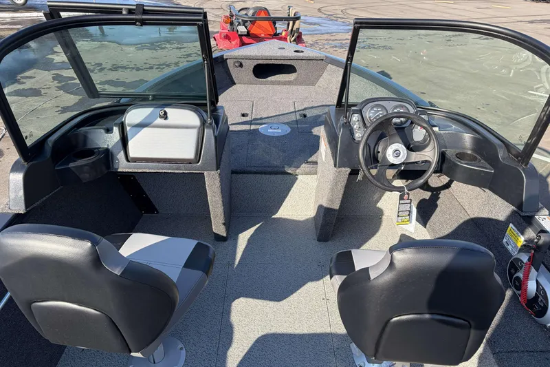 Slide: The Image of 2026 Crestliner 1850 Kodiak WT boat interior with dual seats and steering console. - 8