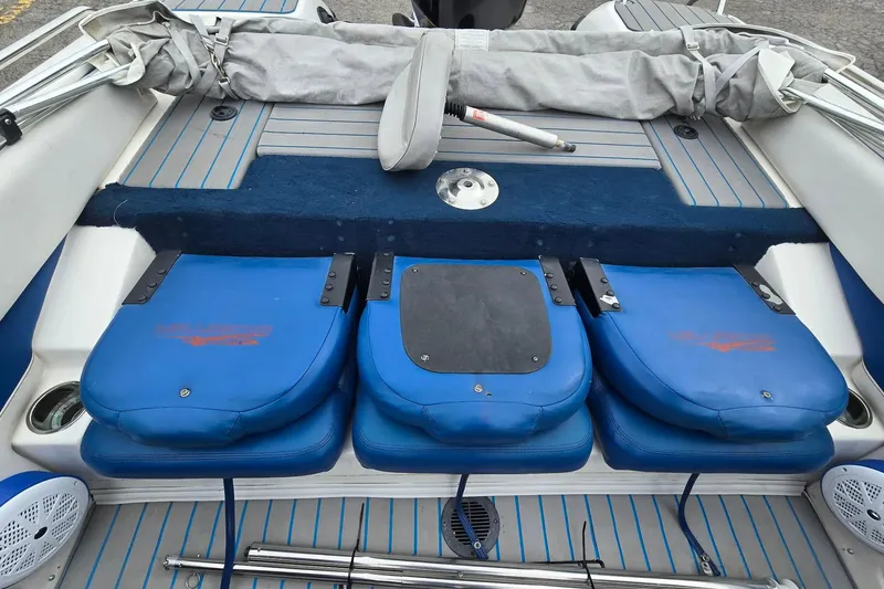 Slide: The Image of 2001 Skeeter SL 190 boat interior with blue seating and striped flooring. - 13