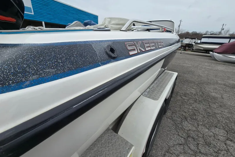 Slide: The Image of 2001 Skeeter SL 190 boat with metallic detailing, parked outdoors. - 17