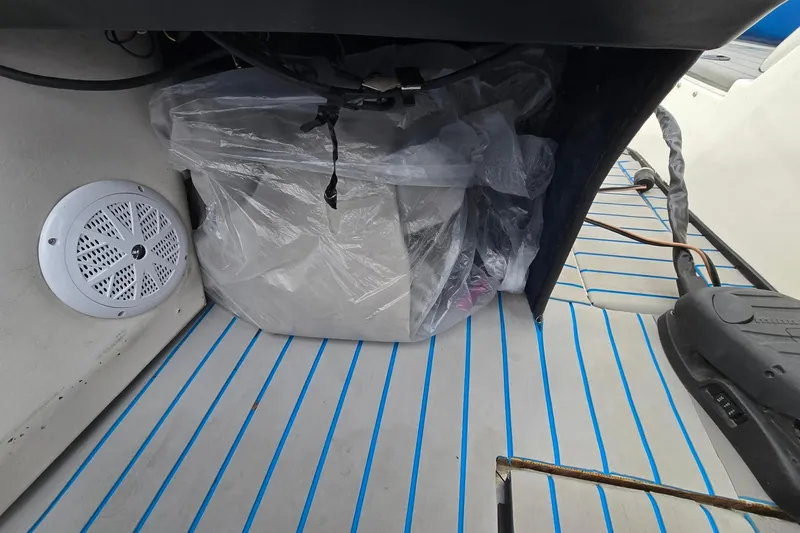 Slide: The Image of 2001 Skeeter SL 190 boat interior with speaker and covered equipment. - 8