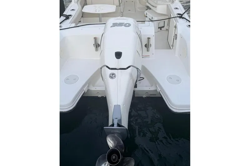 Slide: The Image of 2016 Boston Whaler 230 Vantage boat with powerful outboard motor. - 10