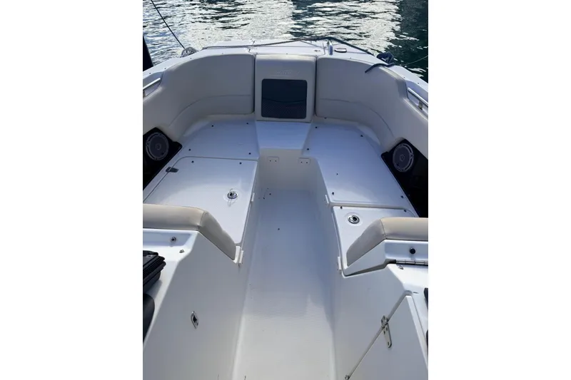 Slide: The Image of 2016 Boston Whaler 230 Vantage boat interior with seating and storage compartments. - 4