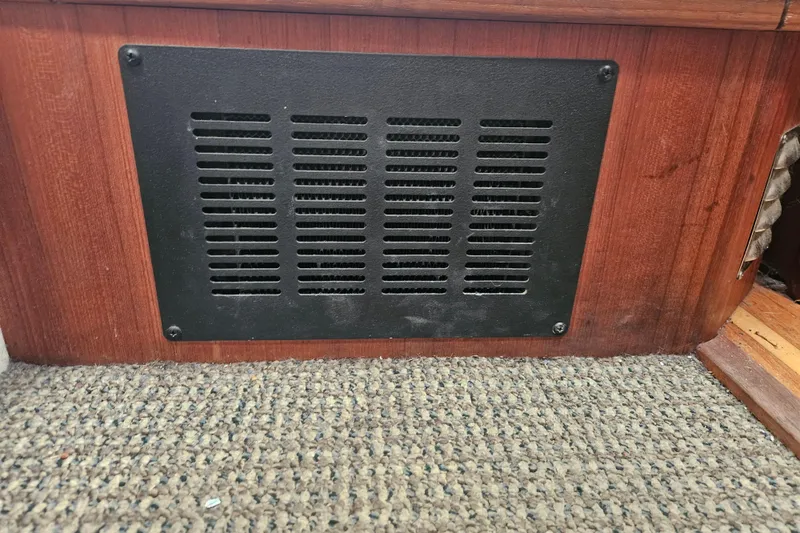 Slide: The Image of Vent panel on 1994 Bayliner 3288 Motoryacht interior, wooden finish, carpeted floor. - 26