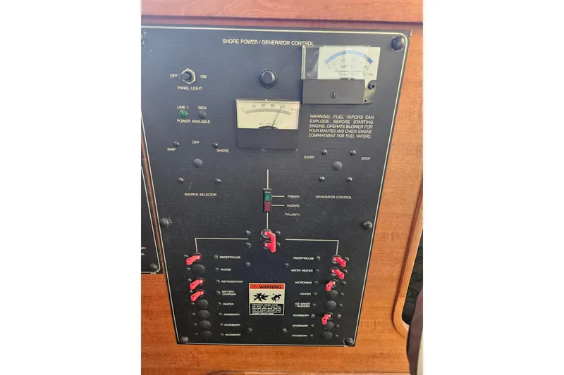 Slide: The Image of Control panel of a 1994 Bayliner 3288 Motoryacht, featuring generator and power switches. - 29