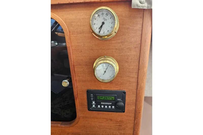 Slide: The Image of 1994 Bayliner 3288 Motoryacht dashboard with brass gauges and electronic display. - 30