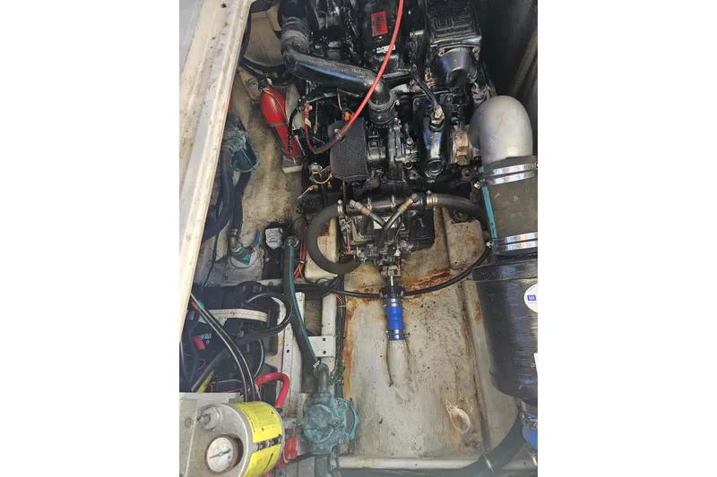 Slide: The Image of Engine compartment of a 1994 Bayliner 3288 Motoryacht, showing mechanical components and wiring. - 35