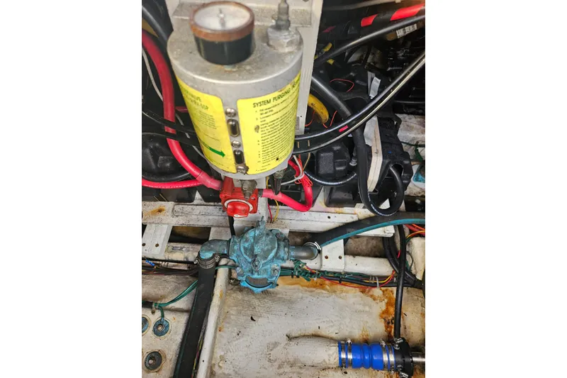 Slide: The Image of Engine compartment of 1994 Bayliner 3288 Motoryacht with visible fuel filter and wiring. - 36