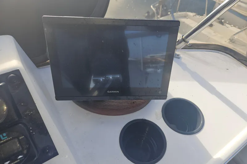 Slide: The Image of Garmin navigation display on 1994 Bayliner 3288 Motoryacht dashboard with cup holders. - 4