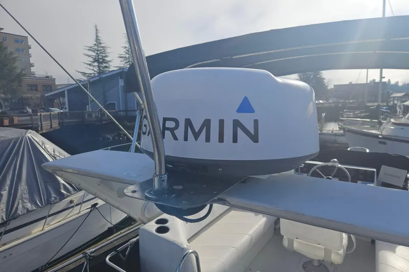 Slide: The Image of 1994 Bayliner 3288 Motoryacht with Garmin radar, docked in a marina. - 6