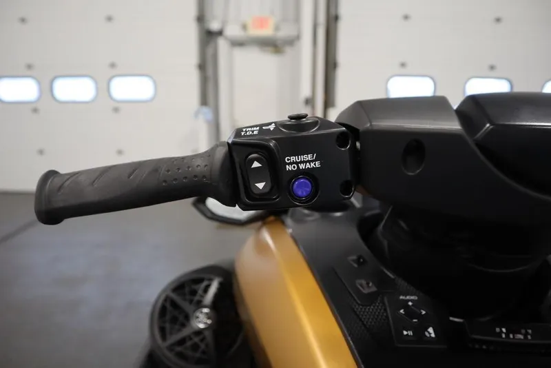 Slide: The Image of 2025 Yamaha WaveRunner FX Cruiser HO handlebar controls in a garage setting. - 10
