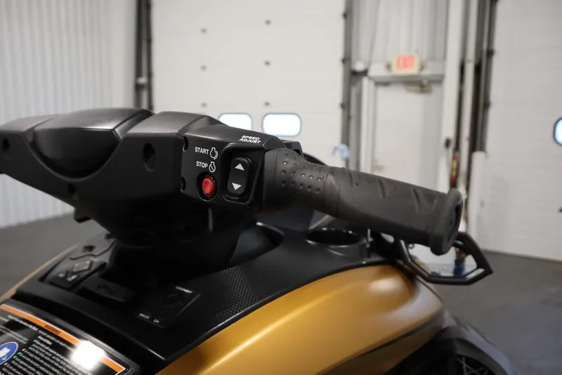 Slide: The Image of 2025 Yamaha WaveRunner FX Cruiser HO handlebar controls in a garage setting. - 11