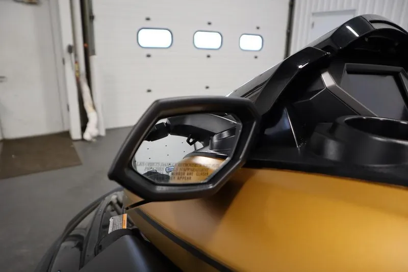 Slide: The Image of 2025 Yamaha WaveRunner FX Cruiser HO side mirror in a garage setting. - 13