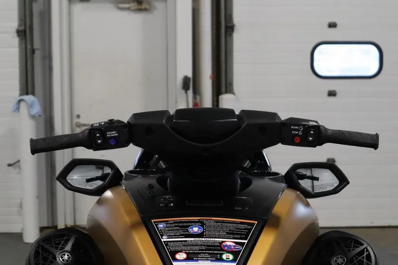 Slide: The Image of 2025 Yamaha WaveRunner FX Cruiser HO handlebars and controls in a garage setting. - 14
