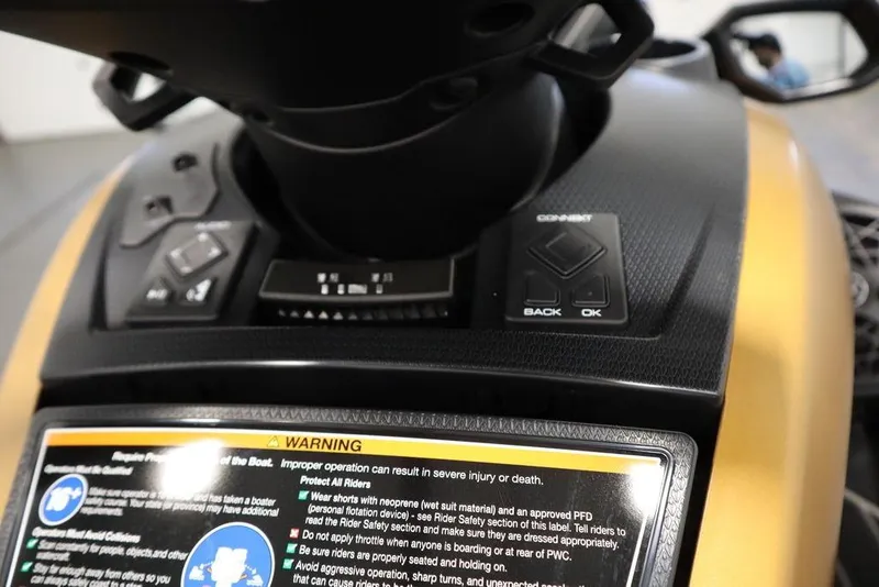 Slide: The Image of 2025 Yamaha WaveRunner FX Cruiser HO dashboard with controls and warning label. - 18