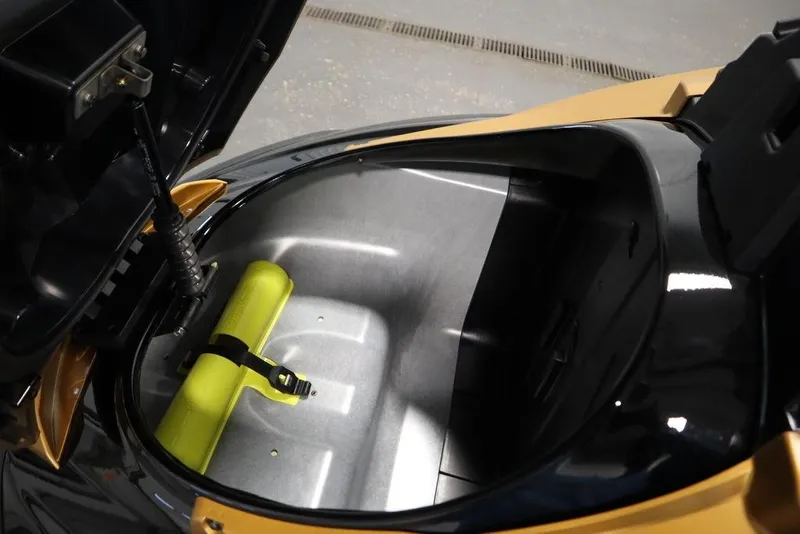 Slide: The Image of Open storage compartment of 2025 Yamaha WaveRunner FX Cruiser HO, featuring a yellow safety item. - 8