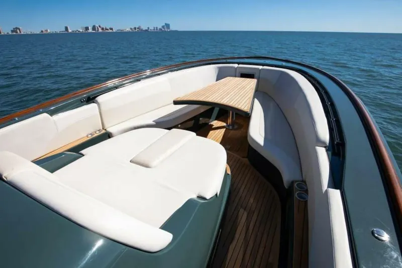 Slide: The Image of Luxurious 2026 Buddy Davis Pininfarina yacht interior with elegant seating and wooden table. - 4