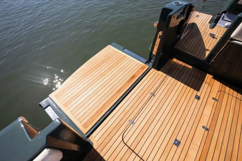 Slide: The Image of Luxury 2026 Buddy Davis Pininfarina boat deck with sleek wooden finish on water. - 6