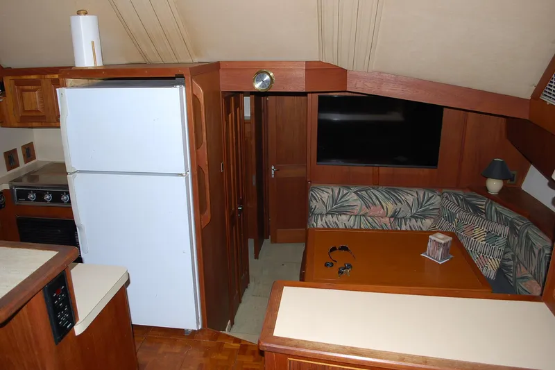 Slide: The Image of Interior of 1988 Viking 45 Convertible yacht with kitchen and seating area. - 16