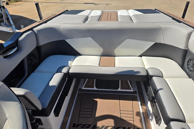 Slide: The Image of 2020 Moomba Helix boat interior with gray and white seating arrangement. - 14
