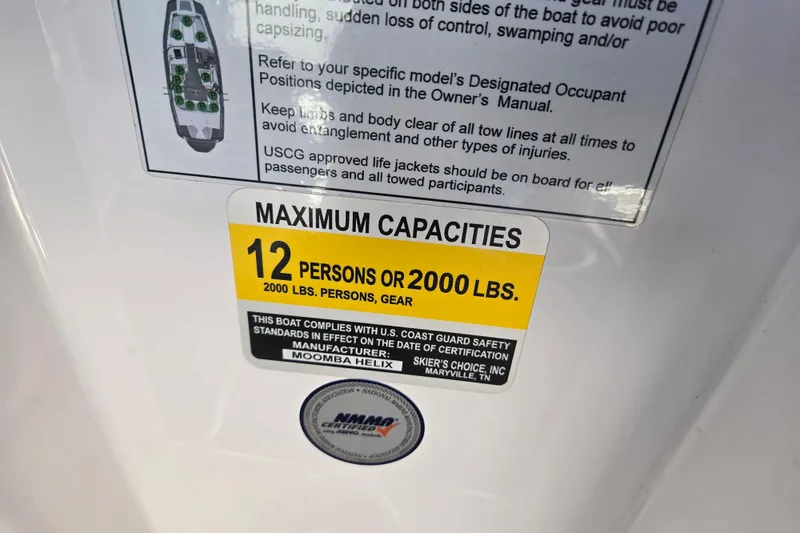 Slide: The Image of 2020 Moomba Helix capacity label: 12 persons or 2000 lbs, USCG compliant. - 23