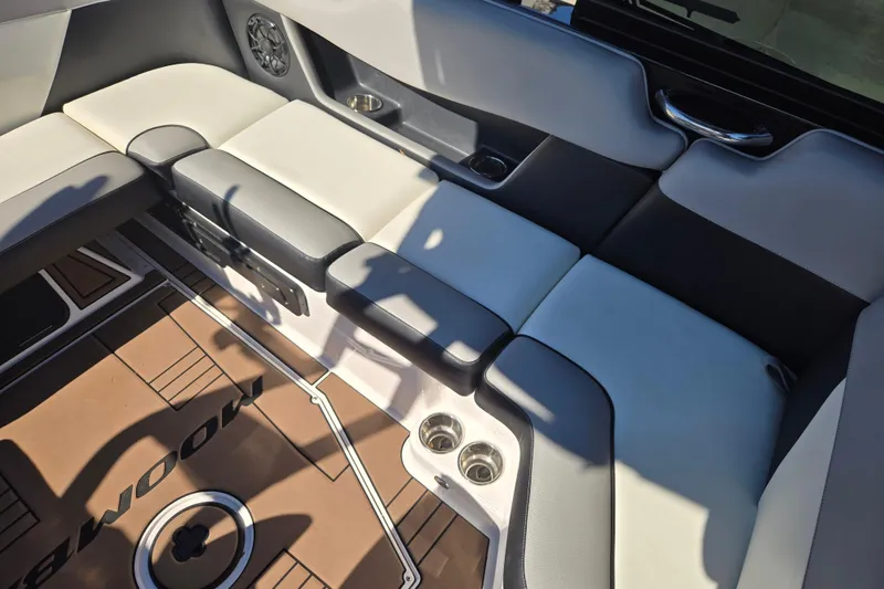 Slide: The Image of 2020 Moomba Helix boat interior with cushioned seating and cup holders. - 29