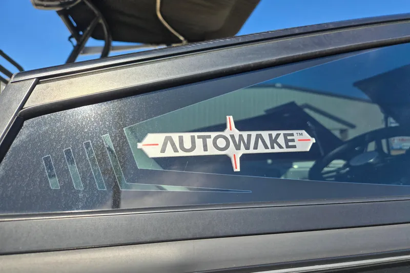 Slide: The Image of 2020 Moomba Helix boat featuring Autowake technology logo on window. - 8