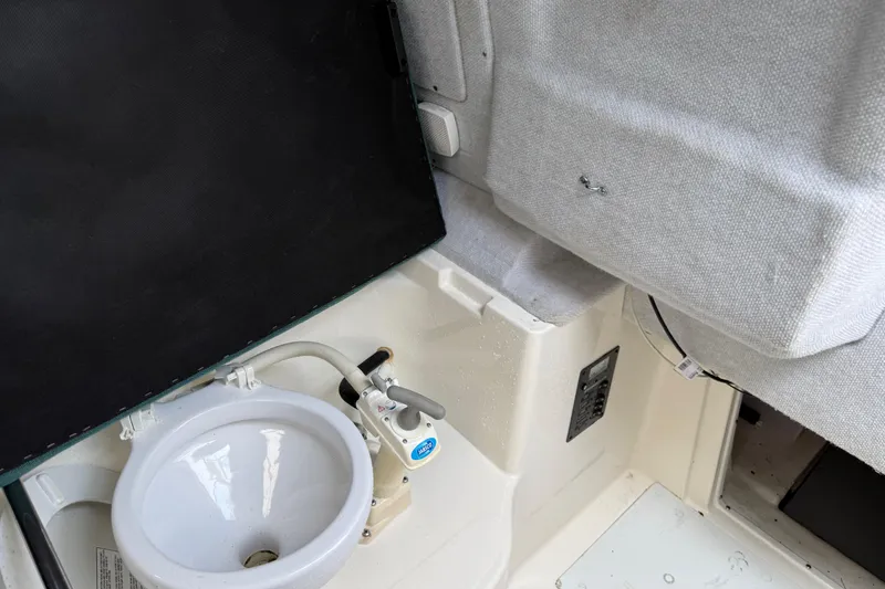 Slide: The Image of Interior of 2006 Trophy 2502 Walkaround boat with sink and seating area. - 20