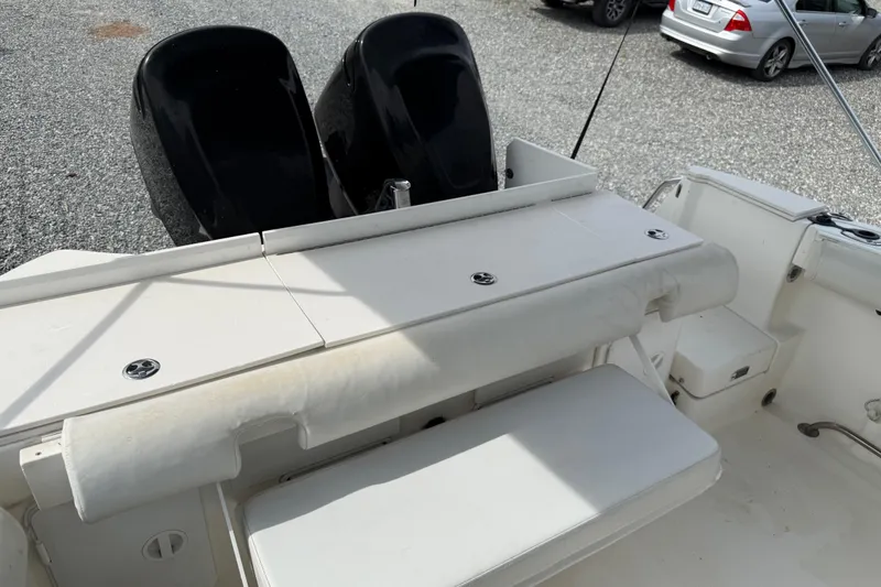Slide: The Image of 2006 Trophy 2502 Walkaround boat interior with seating and dual outboard motors. - 9