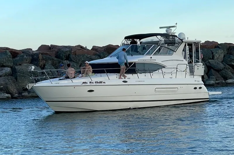 Slide: The Image of 2003 Cruisers Yachts 4450 Express Motoryacht on the water. - 2