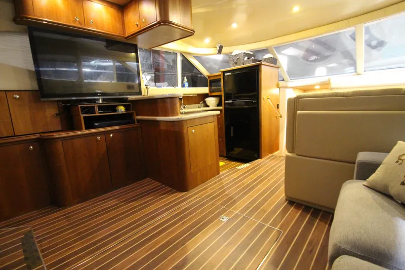 Slide: The Image of Luxurious interior of 2003 Cruisers Yachts 4450 Express Motoryacht with wood finish and modern amenities. - 29