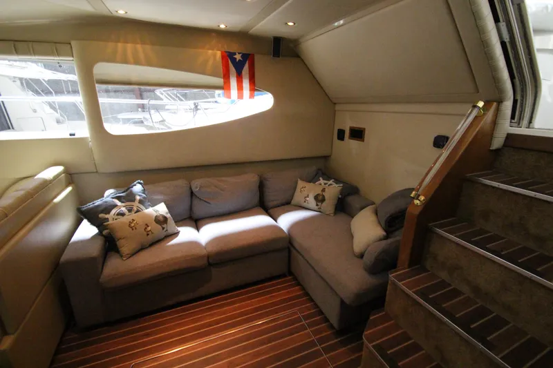 Slide: The Image of Luxurious interior of 2003 Cruisers Yachts 4450 Express Motoryacht with cozy seating and nautical decor. - 31