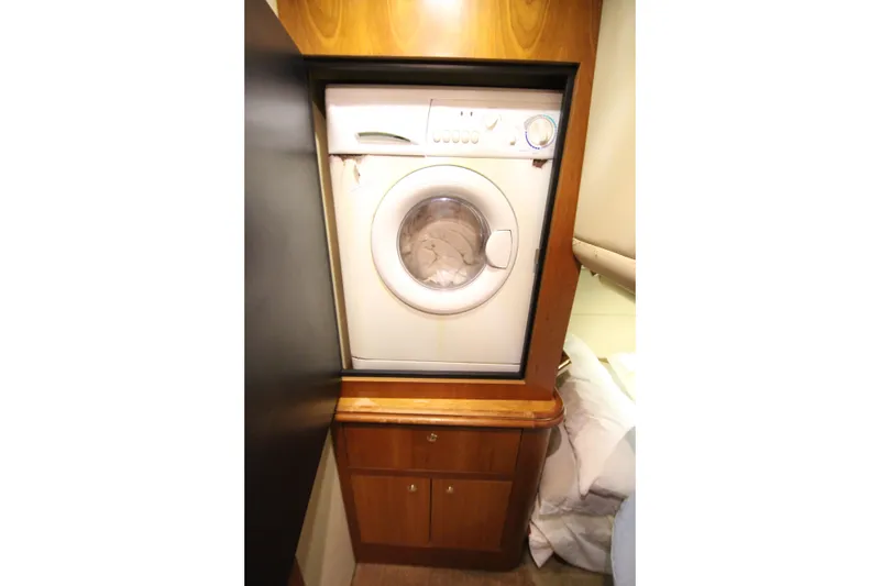 Slide: The Image of Washing machine in 2003 Cruisers Yachts 4450 Express Motoryacht. - 46