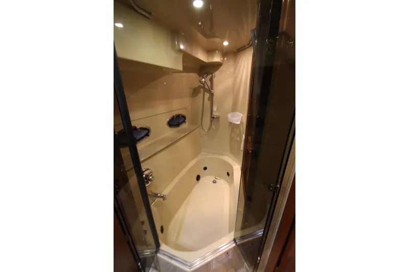 Slide: The Image of Luxurious bathroom in 2003 Cruisers Yachts 4450 Express Motoryacht with shower and tub. - 69