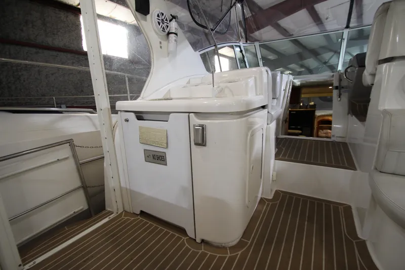 Slide: The Image of 2003 Cruisers Yachts 4450 Express Motoryacht interior with white cabinetry and wood flooring. - 23