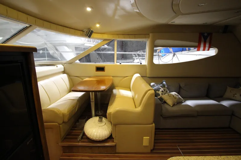 Slide: The Image of Luxurious interior of 2003 Cruisers Yachts 4450 Express Motoryacht with elegant seating and table. - 37