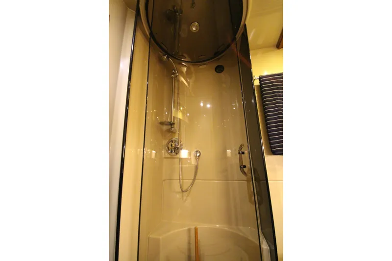 Slide: The Image of Shower area in 2003 Cruisers Yachts 4450 Express Motoryacht, featuring modern fixtures. - 53