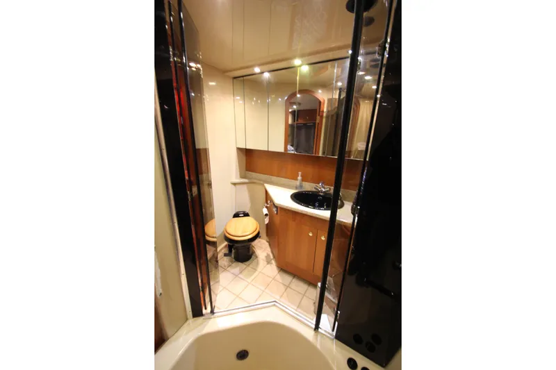 Slide: The Image of Luxurious bathroom in 2003 Cruisers Yachts 4450 Express Motoryacht with modern fixtures. - 70