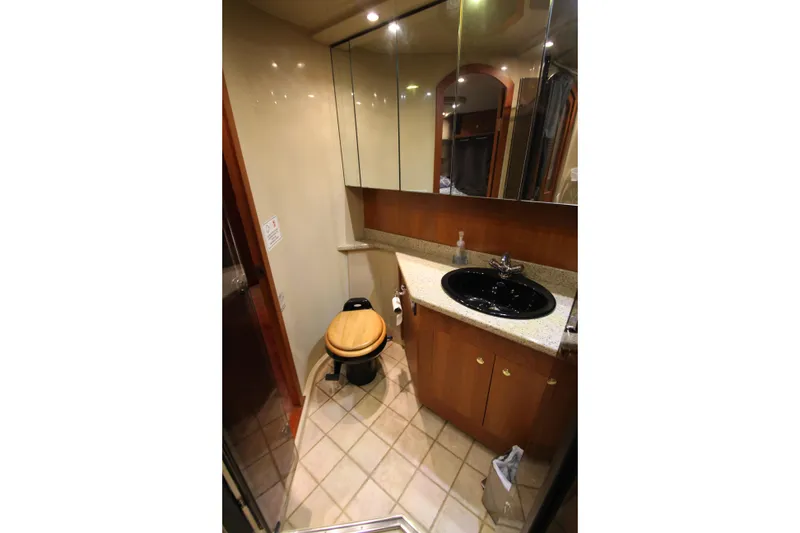 Slide: The Image of Luxurious bathroom in 2003 Cruisers Yachts 4450 Express Motoryacht with elegant fixtures. - 71