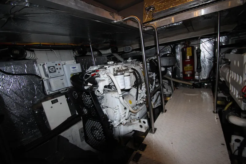 Slide: The Image of Engine room of 2003 Cruisers Yachts 4450 Express Motoryacht, featuring mechanical components. - 75