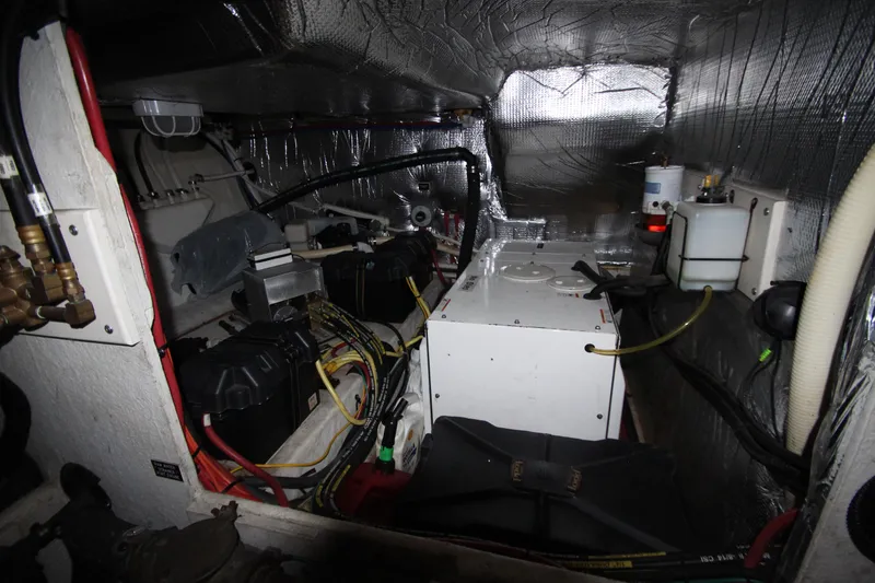 Slide: The Image of Engine room of 2003 Cruisers Yachts 4450 Express Motoryacht with mechanical components. - 77