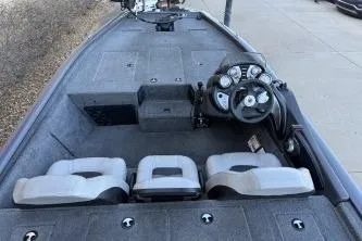 Slide: The Image of 2018 Tracker Pro Team 195 TXW boat interior with steering console and seating. - 6