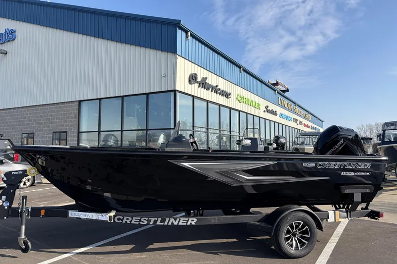 The Image of 2026 Crestliner 1850 Kodiak SC boat on trailer outside dealership. - 0